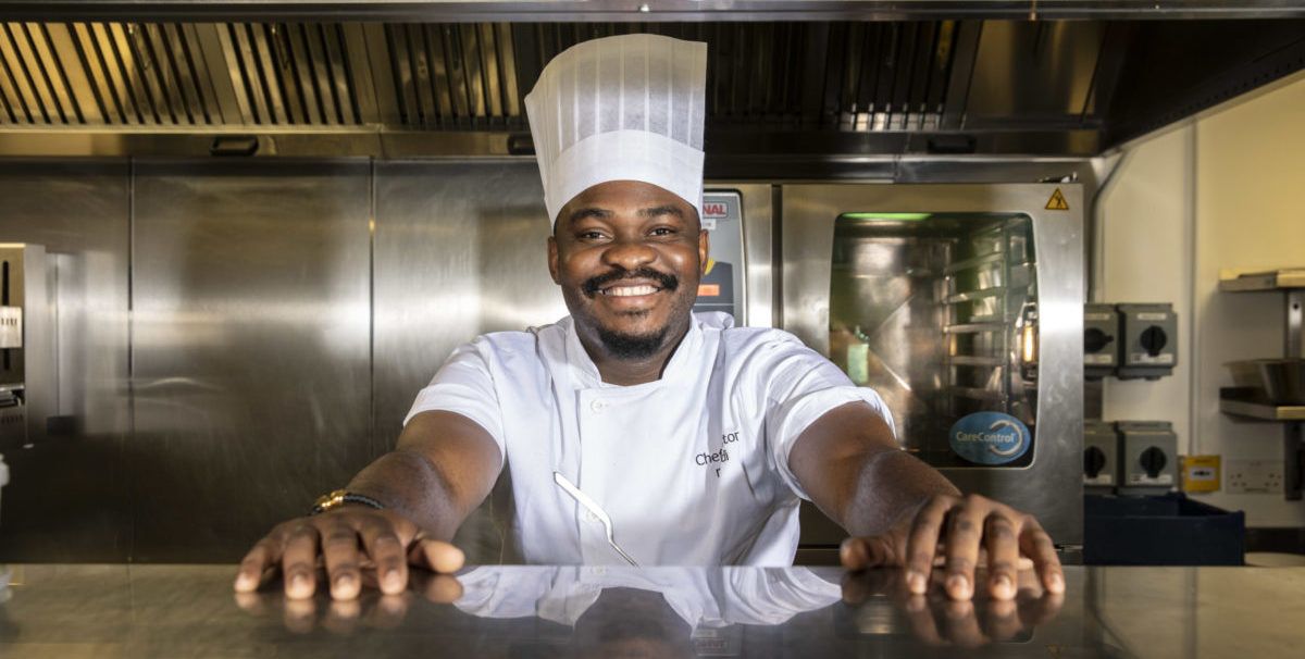 TIMES CHRISTMAS APPEAL Congolese chef Nestor Masudi in the kitchens in the News Building Photograph by Richard Pohle